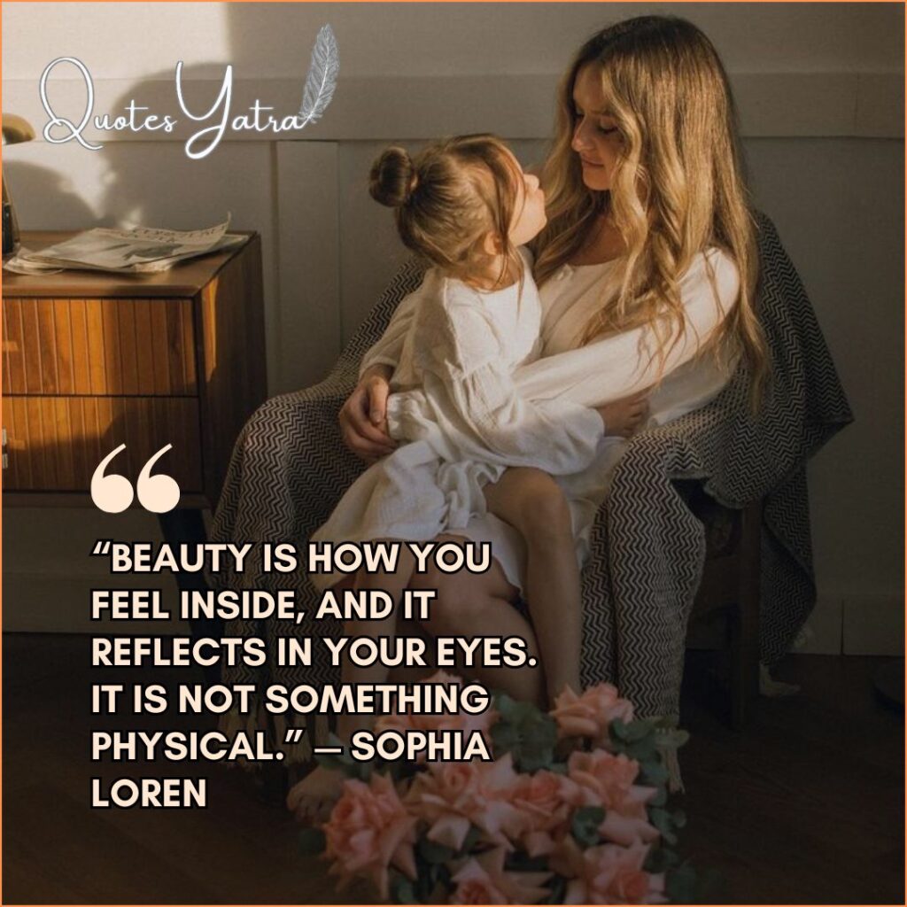 A mother sitting in an armchair holding her young daughter on her lap, gazing into each other's eyes. Text quote: Sophia Loren on beauty reflecting in the eyes.