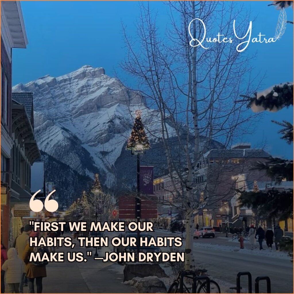 A snowy mountain town street with a decorated Christmas tree and high peaks in the background. Quote: "First we make our habits, then our habits make us." — John Dryden.