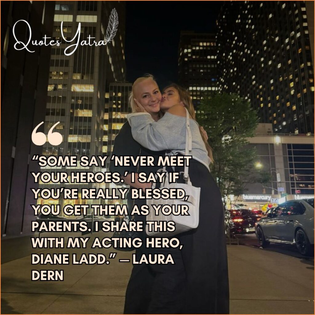 Adult daughter hugging her mother in a city setting at night.