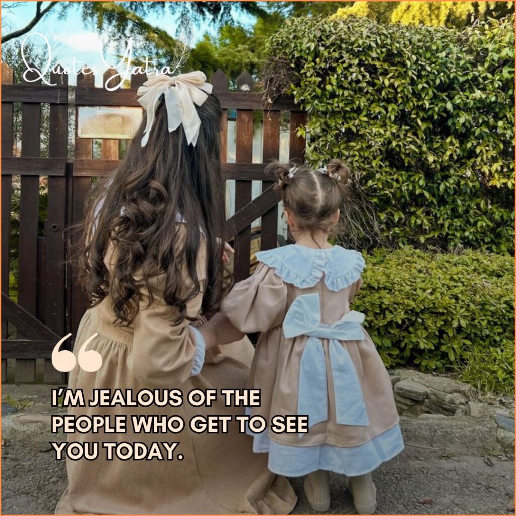 Two little girls standing by a garden gate, looking beyond it together.