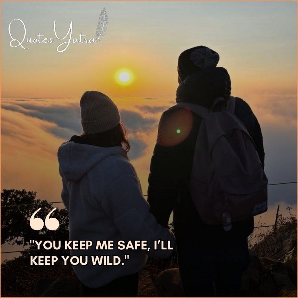 Silhouette of a couple standing together watching a golden sunset above a sea of clouds with the romantic quote "You keep me safe, I’ll keep you wild."