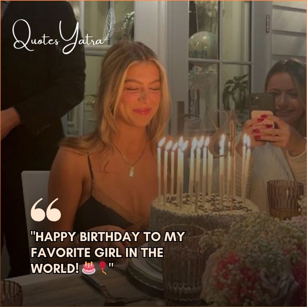 A daughter smiling in front of a birthday cake while someone nearby captures the moment on a phone.