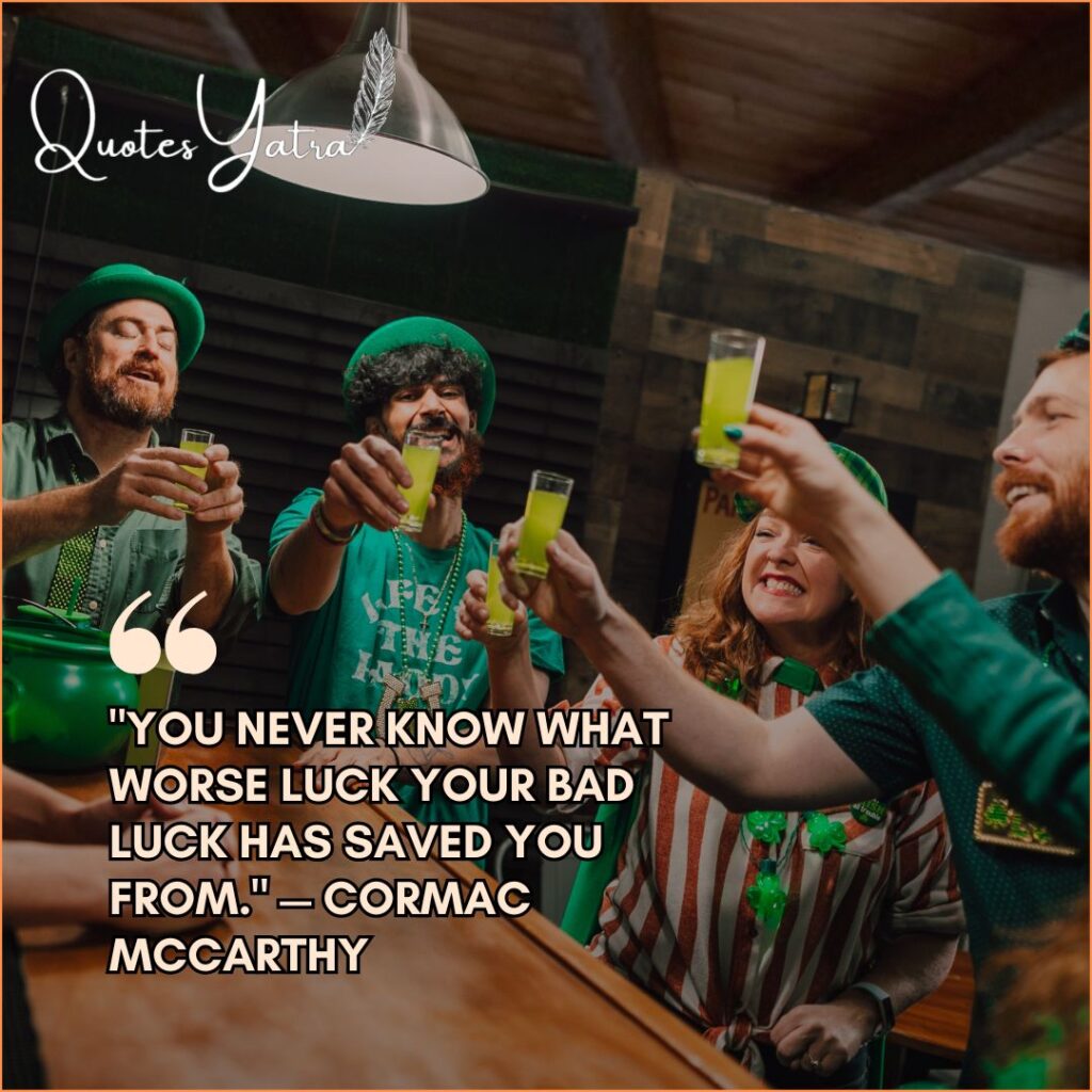 Friends raising green drinks in pub celebration with luck quote St. Patrick’s Day