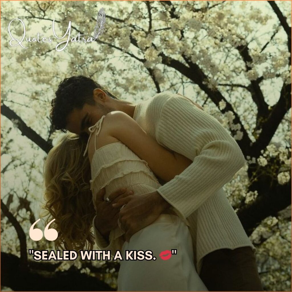 Aesthetic Kiss Day caption image showing a couple embracing under cherry blossoms with the text "Sealed with a kiss".