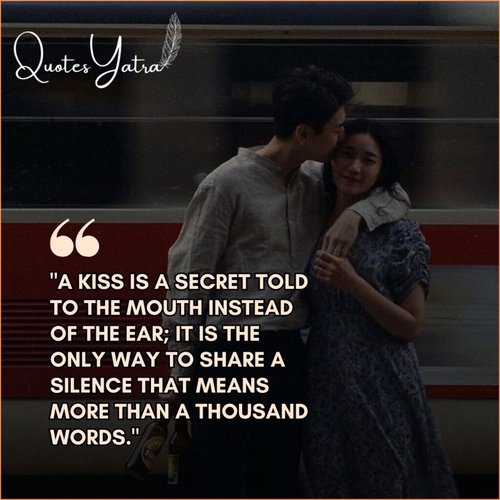 Cinematic shot of a couple standing by a train sharing a quiet, intimate moment with text overlay.